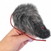 Gray finger mouse puppet held in hand, enhanced clarity