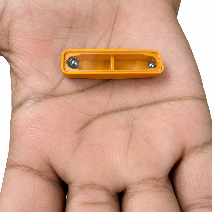 Enhanced view of the Seven Second Puzzle micro size, orange case with two steel balls