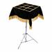 Magicians Table top with black velvet and gold fringe on a white background