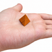 Micro pyramid puzzle resting on a hand
