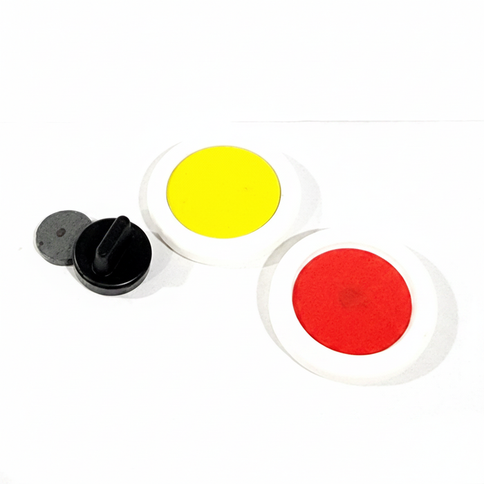 Magic prop discs with yellow and red centers on white background